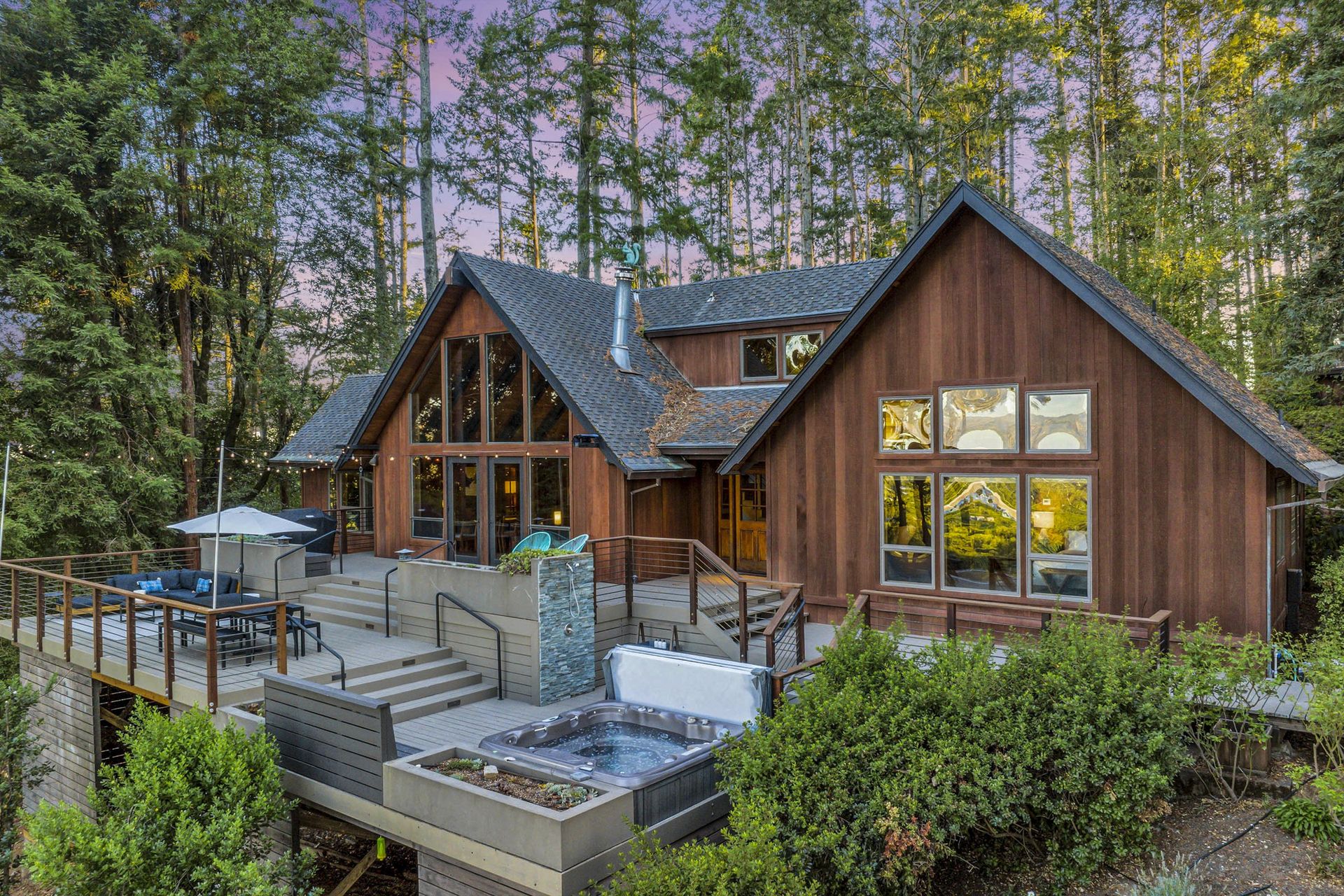 Casa de Lucca A-frame glowing at twilight