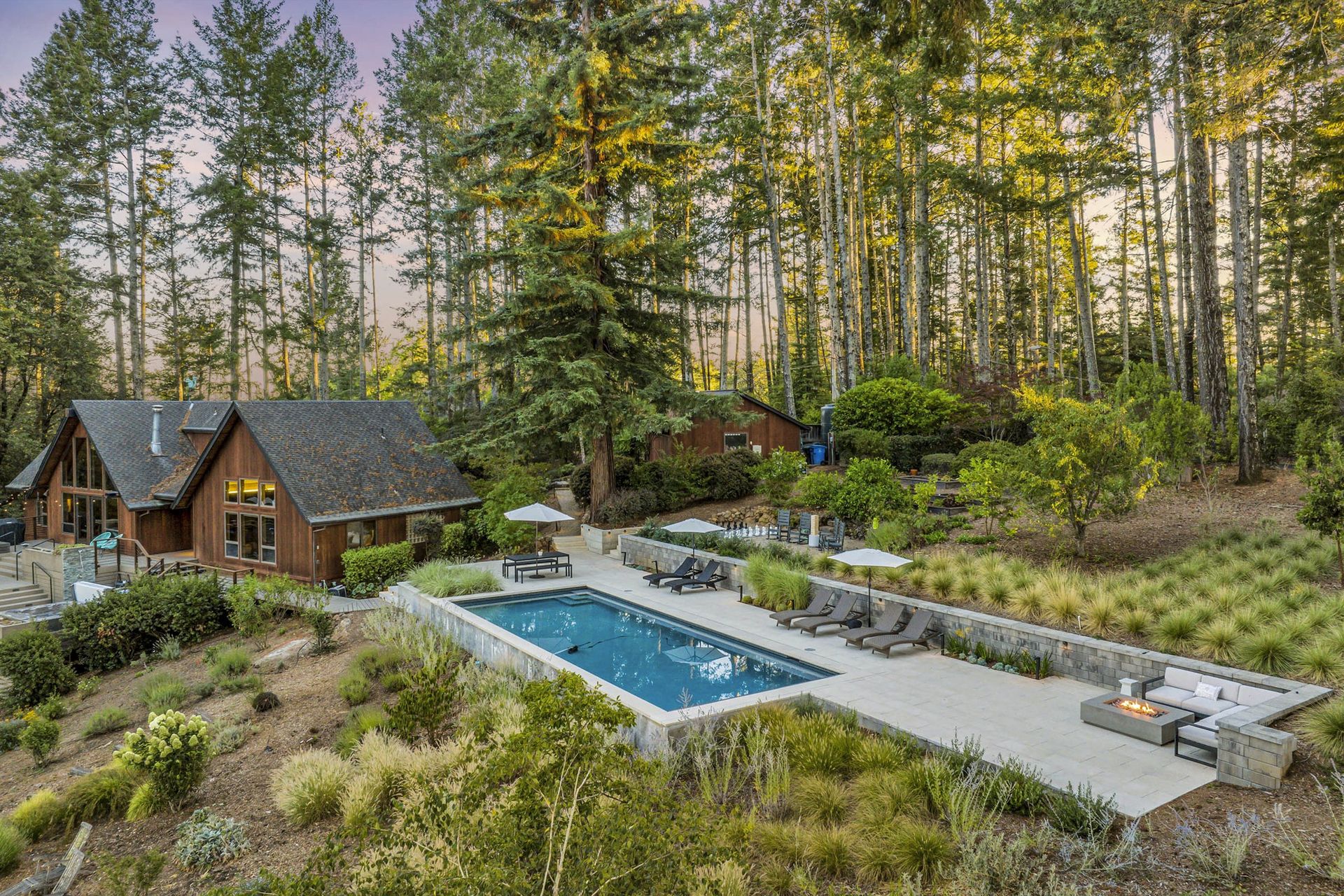 Casa de Lucca pool with house lit behind