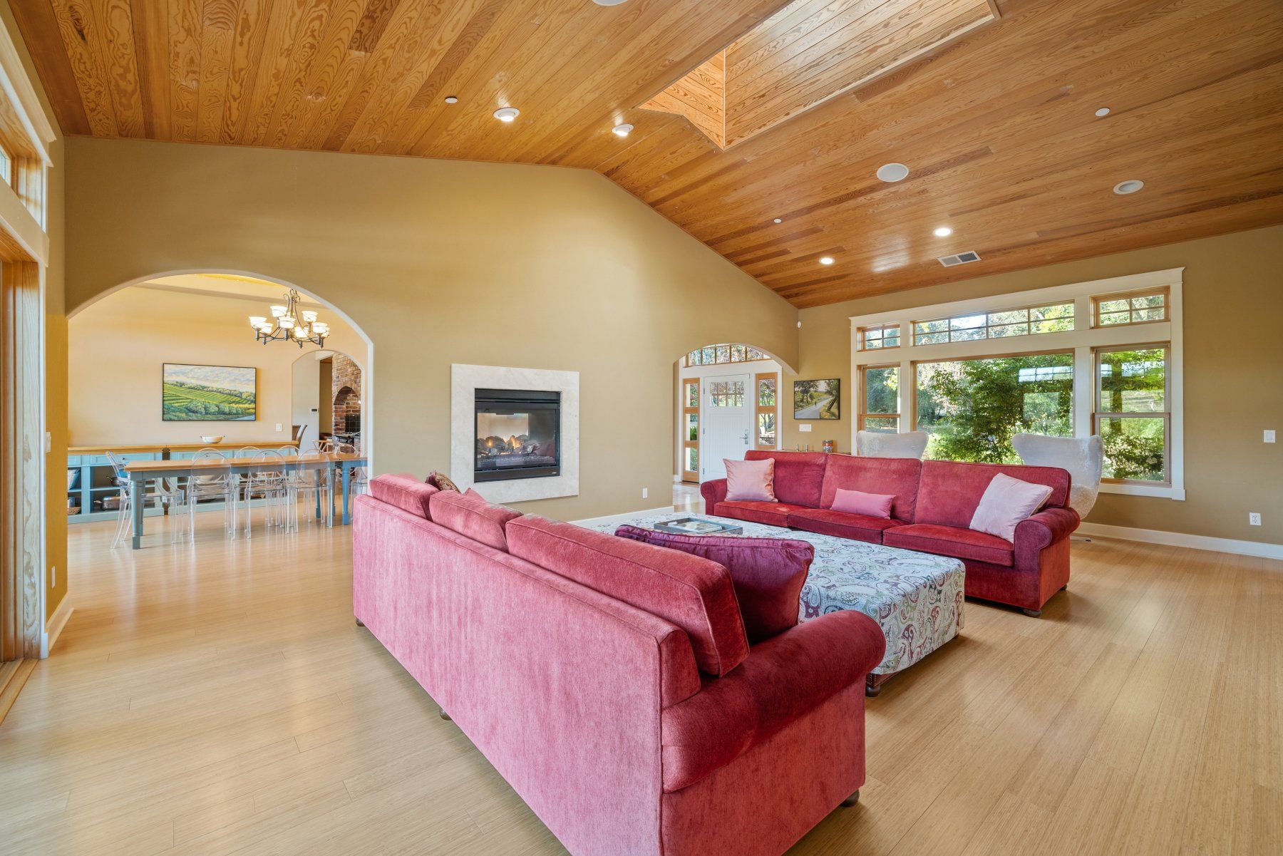 Creekfront living room with vaulted ceiling