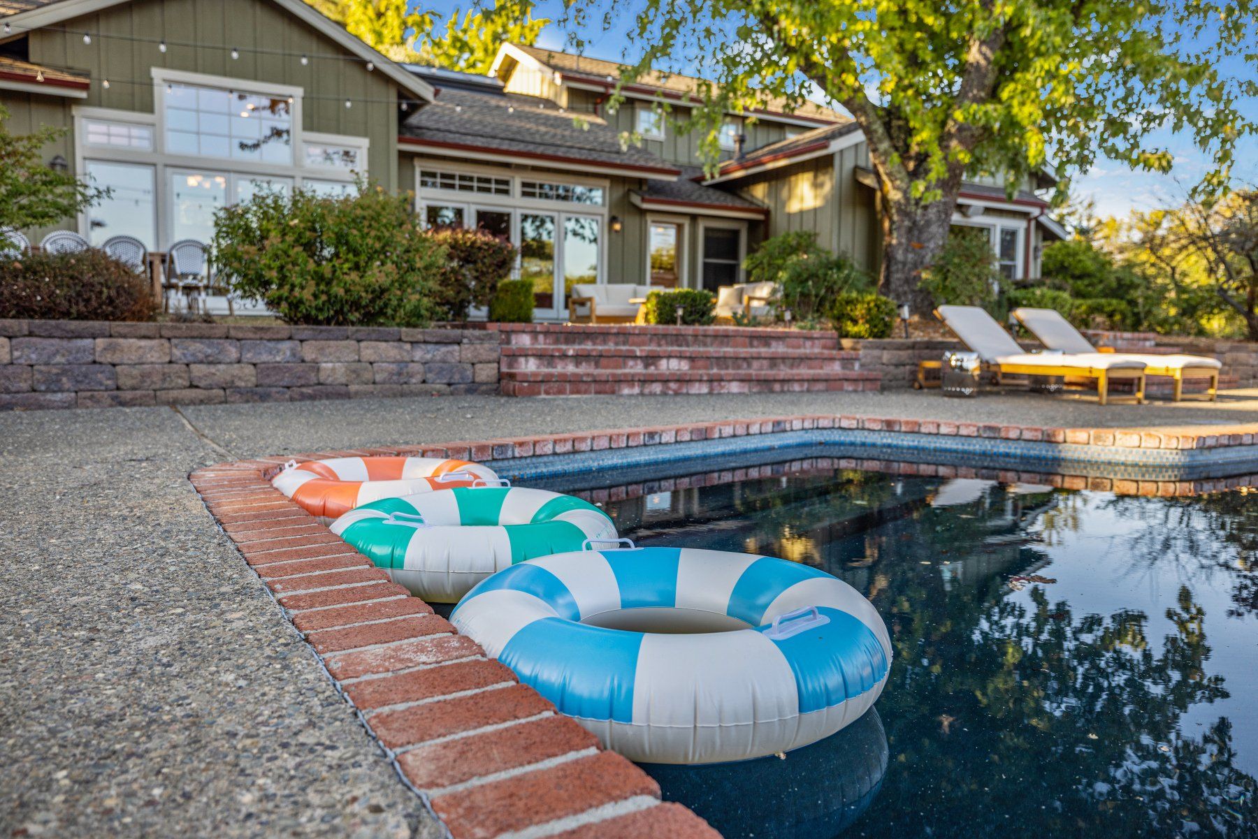 Creekfront pool with vineyard surround